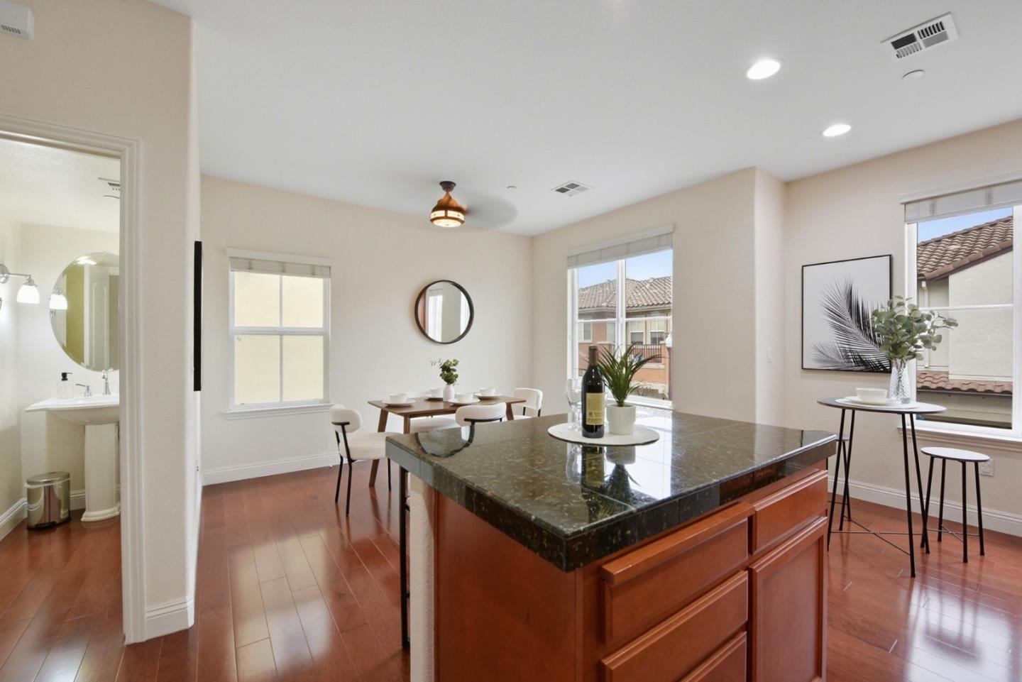48962 Woodgrove Common Fremont, CA 94539 - Photo 9 of 36 a kitchen with a table and chairs in it