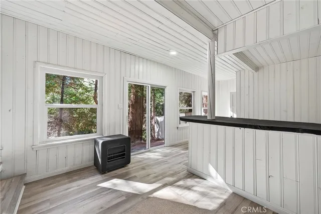 a view of a hallway with windows