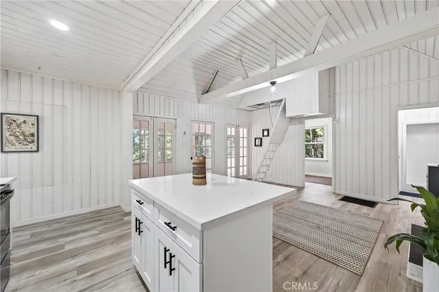 a view of kitchen with cabinets and wooden floor