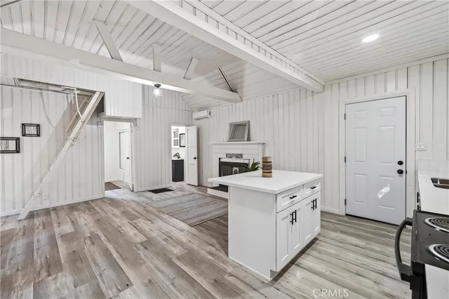 a view of a kitchen with electric appliances