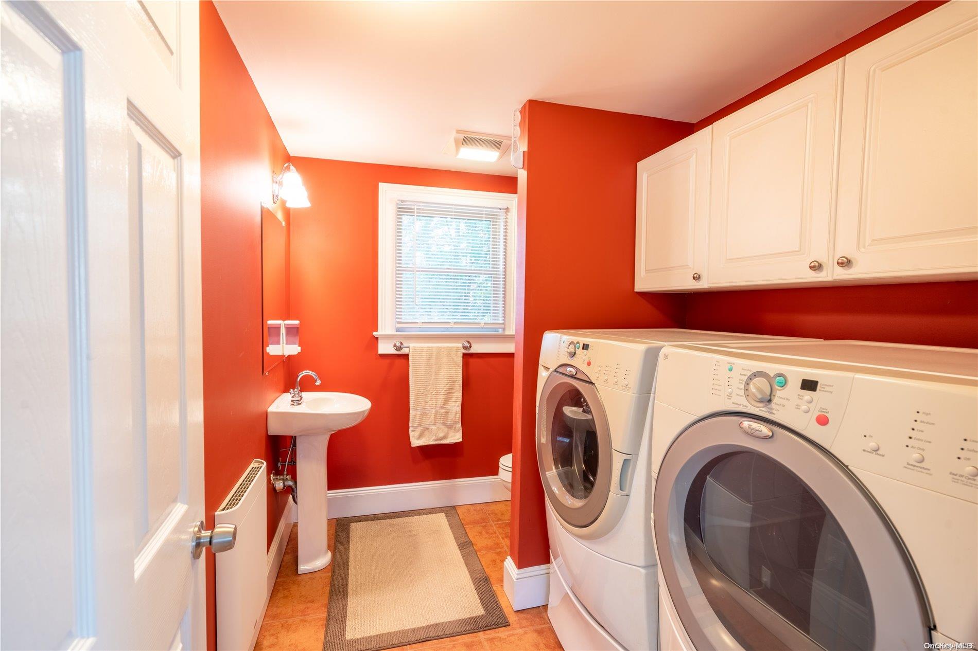 231 5th Avenue Greenport, NY 11944 - Photo 17 of 18 a view of a room with washer and dryer