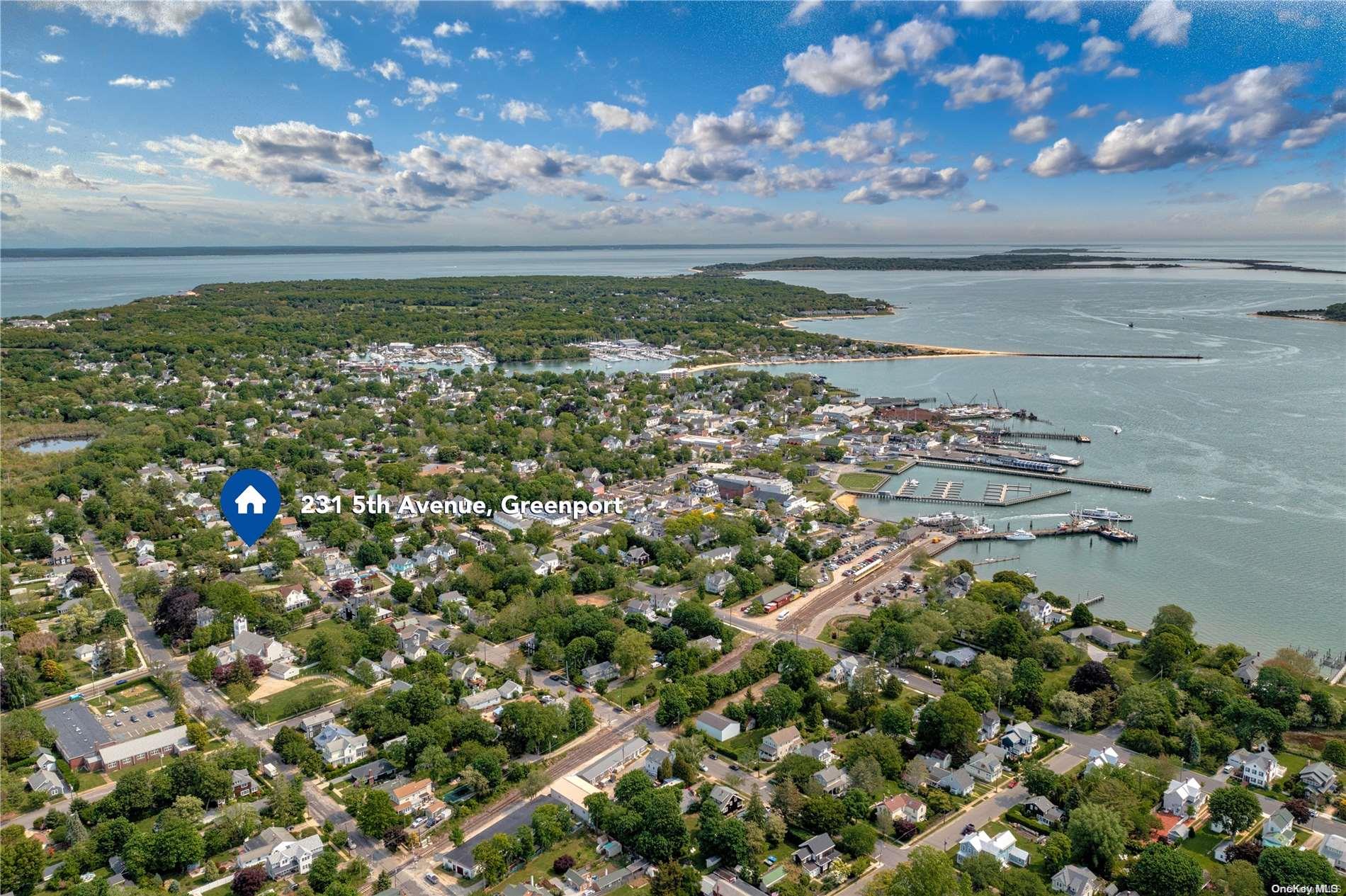 231 5th Avenue Greenport, NY 11944 - Photo 2 of 18 a view of an outdoor space and a lake view