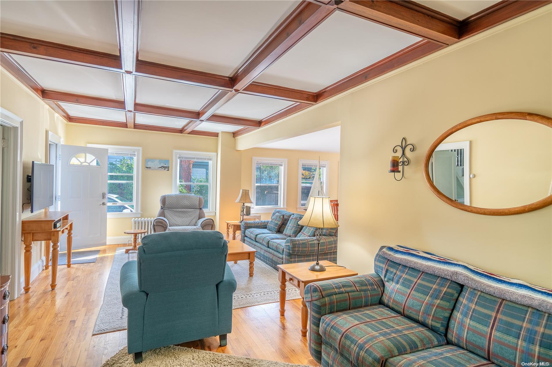 231 5th Avenue Greenport, NY 11944 - Photo 8 of 18 a living room with furniture and a large window
