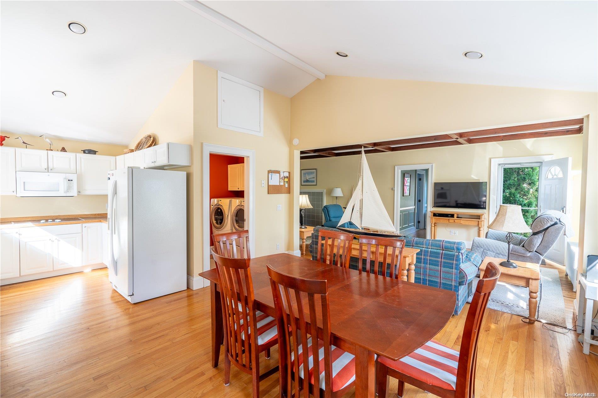 231 5th Avenue Greenport, NY 11944 - Photo 9 of 18 a view of a dining room with furniture window and wooden floor