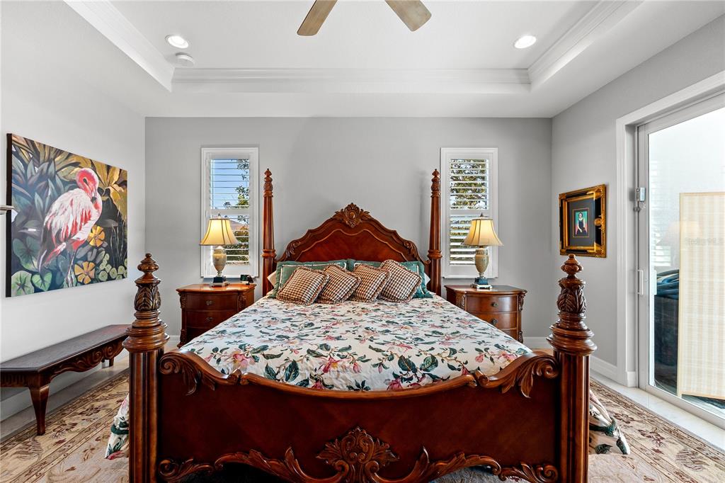 10491 Sarasota Road Port Charlotte, FL 33981 - Photo 15 of 44 a bed sitting in a bedroom next to a window