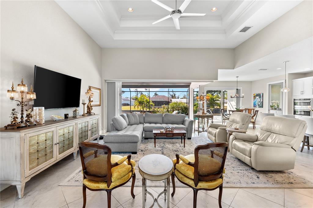 10491 Sarasota Road Port Charlotte, FL 33981 - Photo 4 of 44 a living room with furniture and a flat screen tv