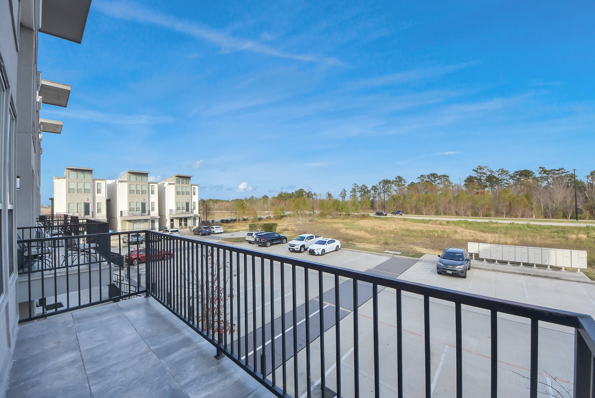 18716 Centro Main Street Conroe, TX 77385 - Photo 21 of 50 Private balcony overlooking the Centro community. Digitally Enhanced.