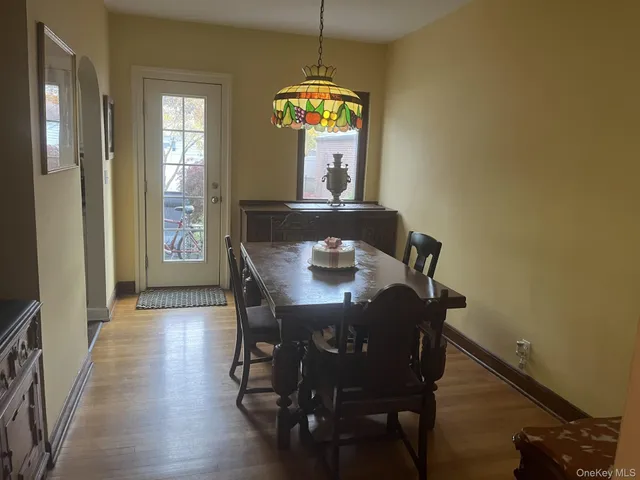 a view of a dining room with furniture and window