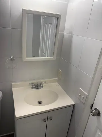 a bathroom with a sink and mirror