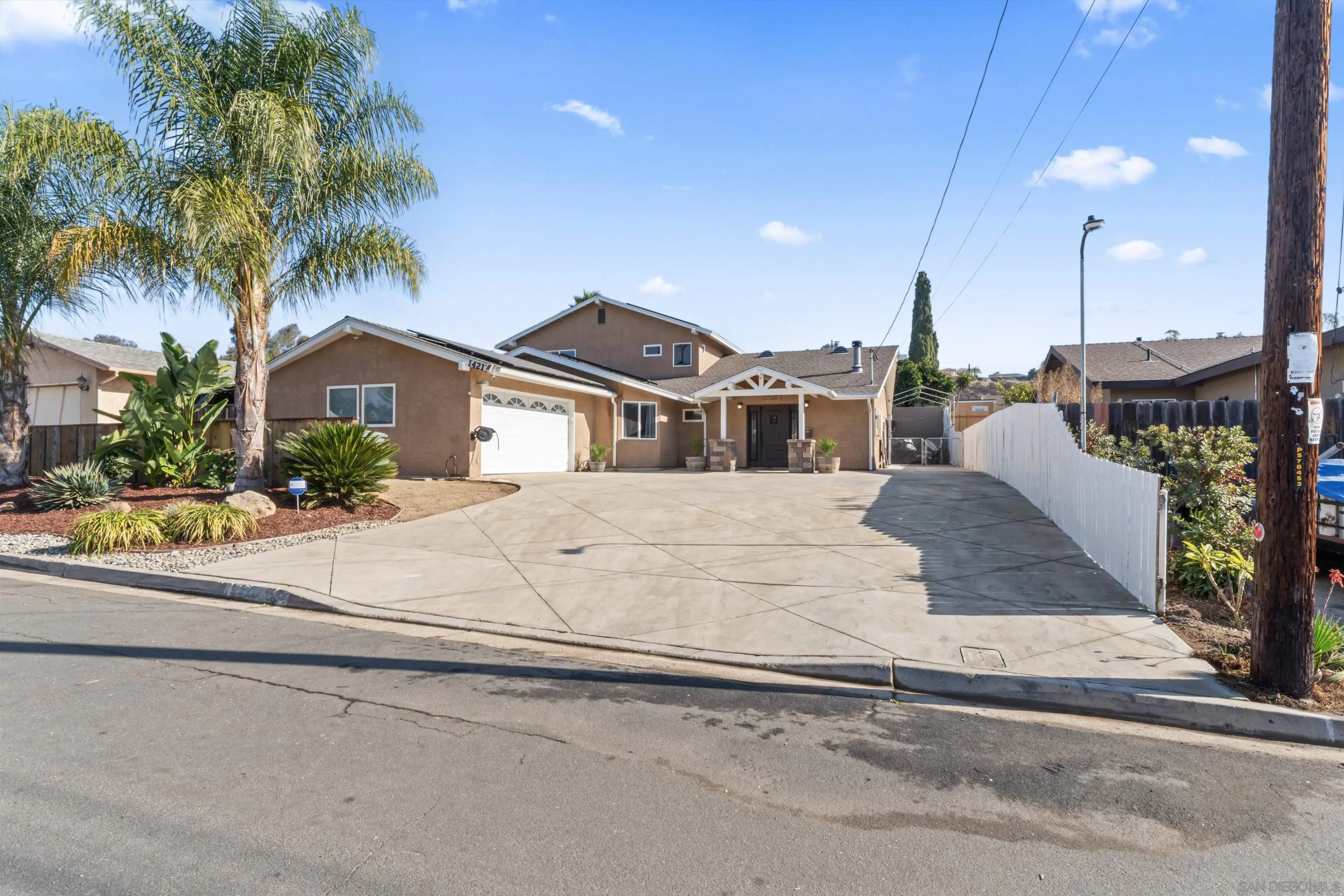14211 Frame Road Poway, CA 92064 - Photo 5 of 11 a view of a house with a yard and potted plants