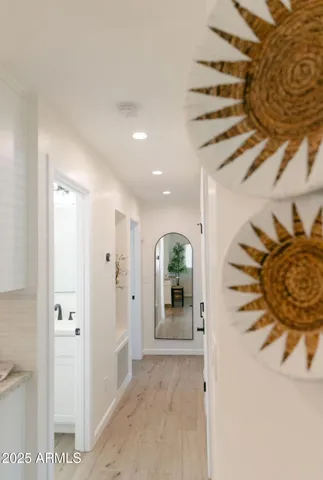 a view of a hallway with wooden shelves