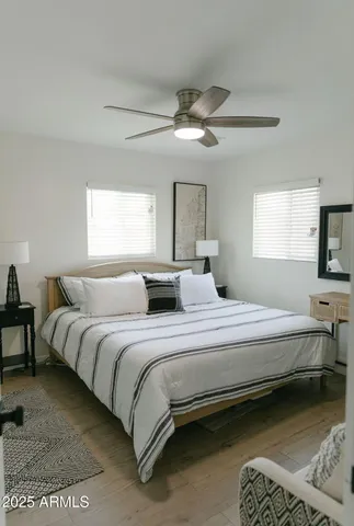 a bedroom with bed and window
