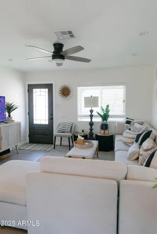 a living room with furniture and window