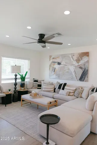 a living room with furniture and a table