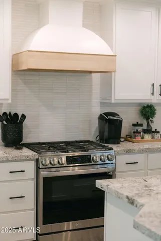 a kitchen with a stove and a microwave