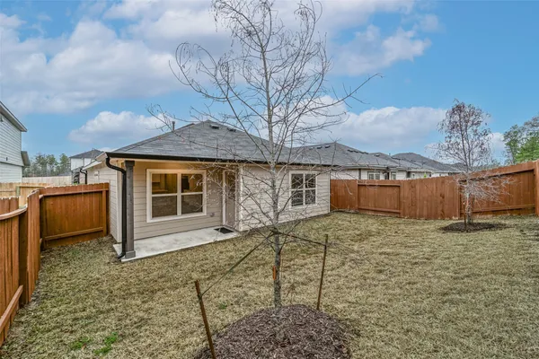 a house view with a backyard space