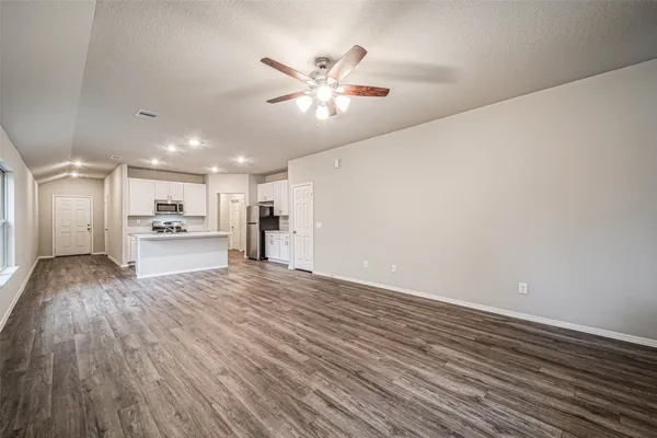 a view of a livingroom with a hardwood floor