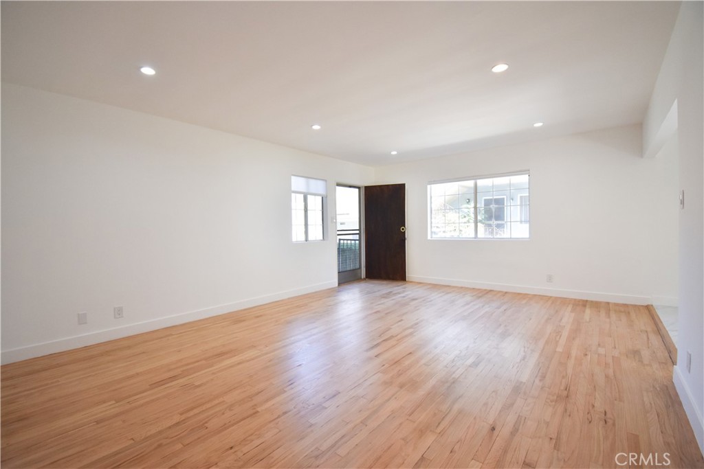 1570 North Verdugo Road, Unit B Glendale, CA 91208 - Photo 6 of 12 a view of an empty room with wooden floor and window
