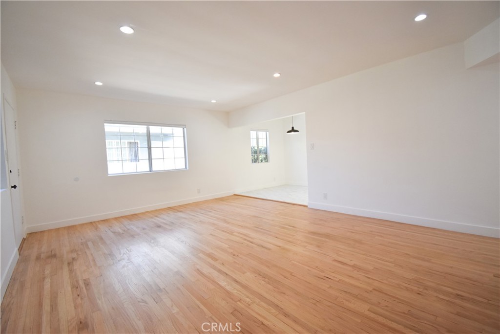 1570 North Verdugo Road, Unit B Glendale, CA 91208 - Photo 7 of 12 an empty room with wooden floor and windows