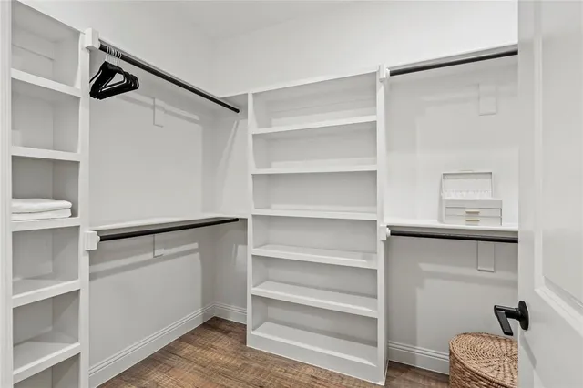 a bathroom with a double vanity sink mirror and shower