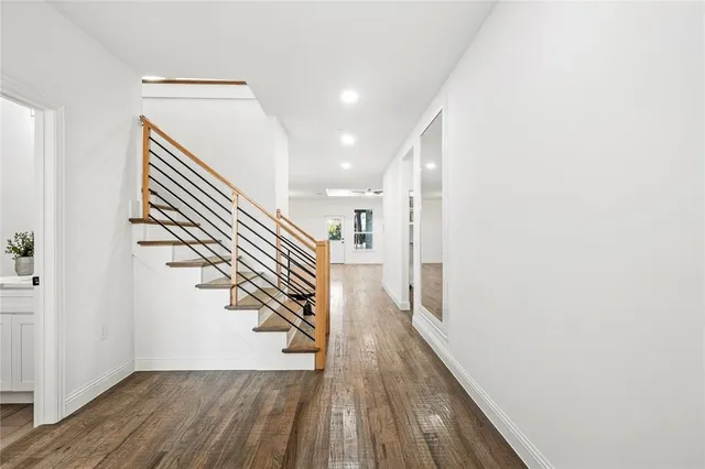 a workspace with wooden floor and a window