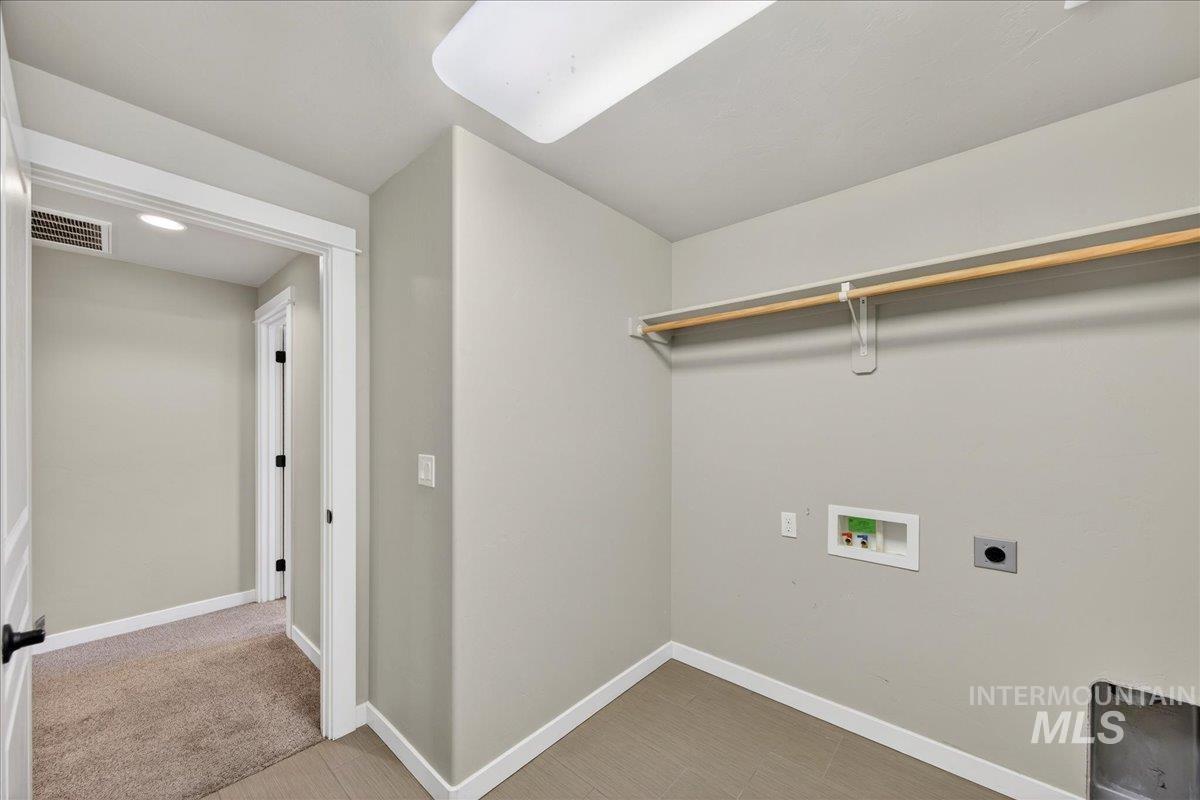 12200 West Oneida Street Boise, ID 83709 - Photo 22 of 35 Laundry area with electric dryer hookup and hookup for a washing machine