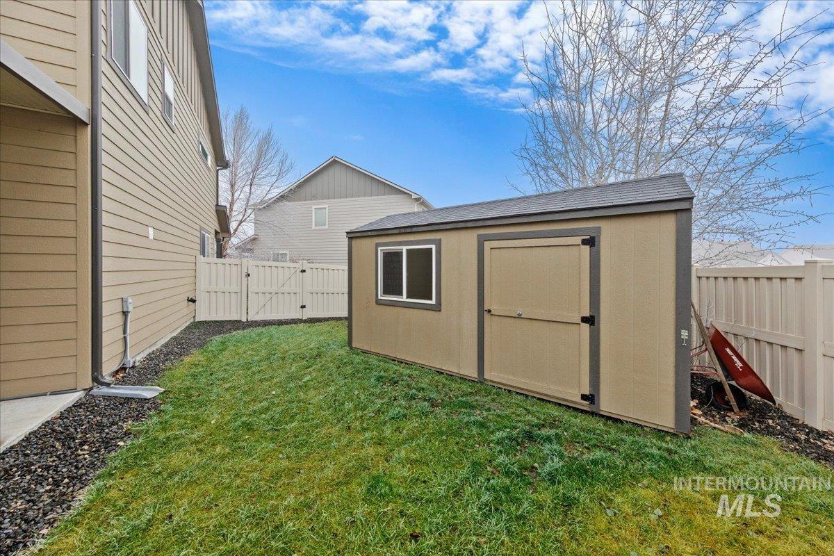 12200 West Oneida Street Boise, ID 83709 - Photo 30 of 35 View of shed featuring a gate and a fenced backyard