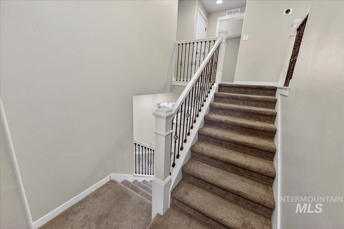 12200 West Oneida Street Boise, ID 83709 - Photo 6 of 35 Staircase featuring baseboards and carpet
