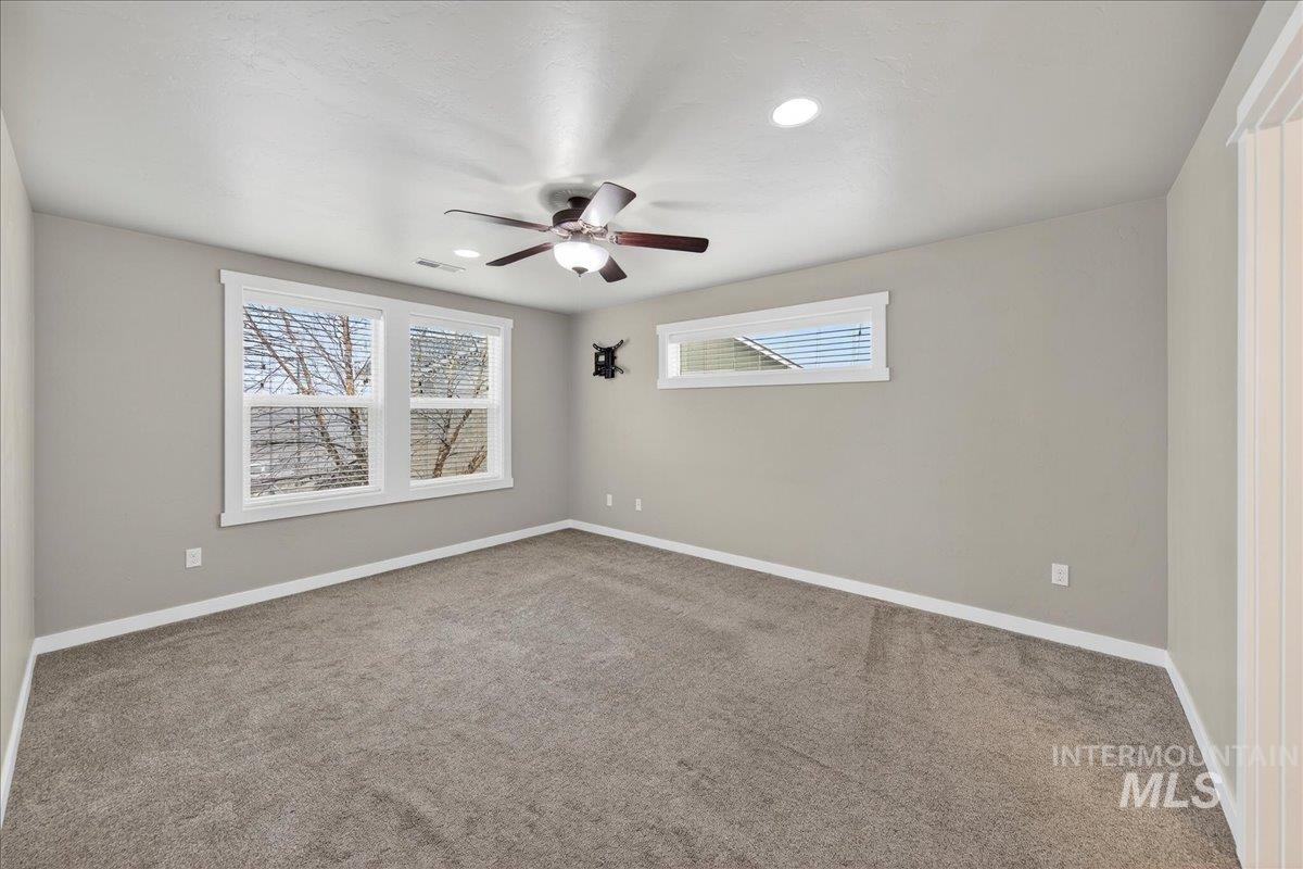 12200 West Oneida Street Boise, ID 83709 - Photo 7 of 35 Carpeted empty room with recessed lighting and a ceiling fan