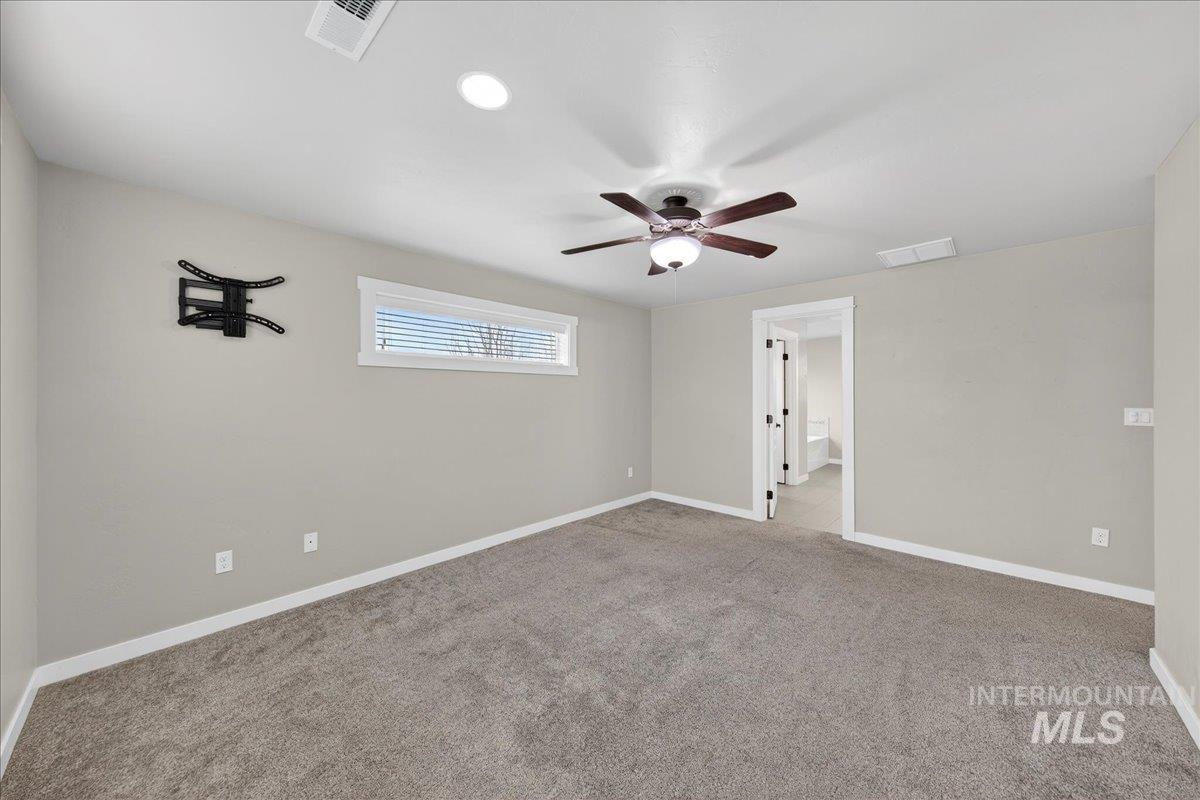 12200 West Oneida Street Boise, ID 83709 - Photo 8 of 35 Carpeted spare room featuring a ceiling fan and recessed lighting