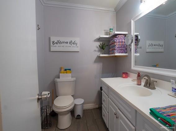 3200 Hummingbird Avenue McAllen, TX 78504 - Photo 19 of 31 a bathroom with a sink mirror vanity and toilet