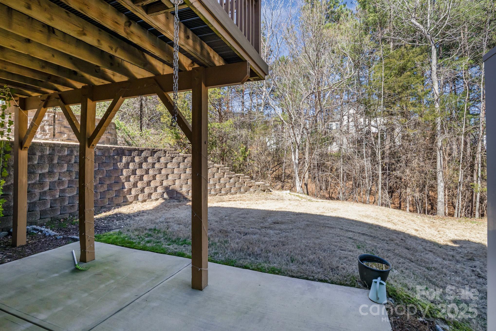 121 Inlet Point Drive Tega Cay, SC 29708 - Photo 17 of 18 a view of backyard with green space