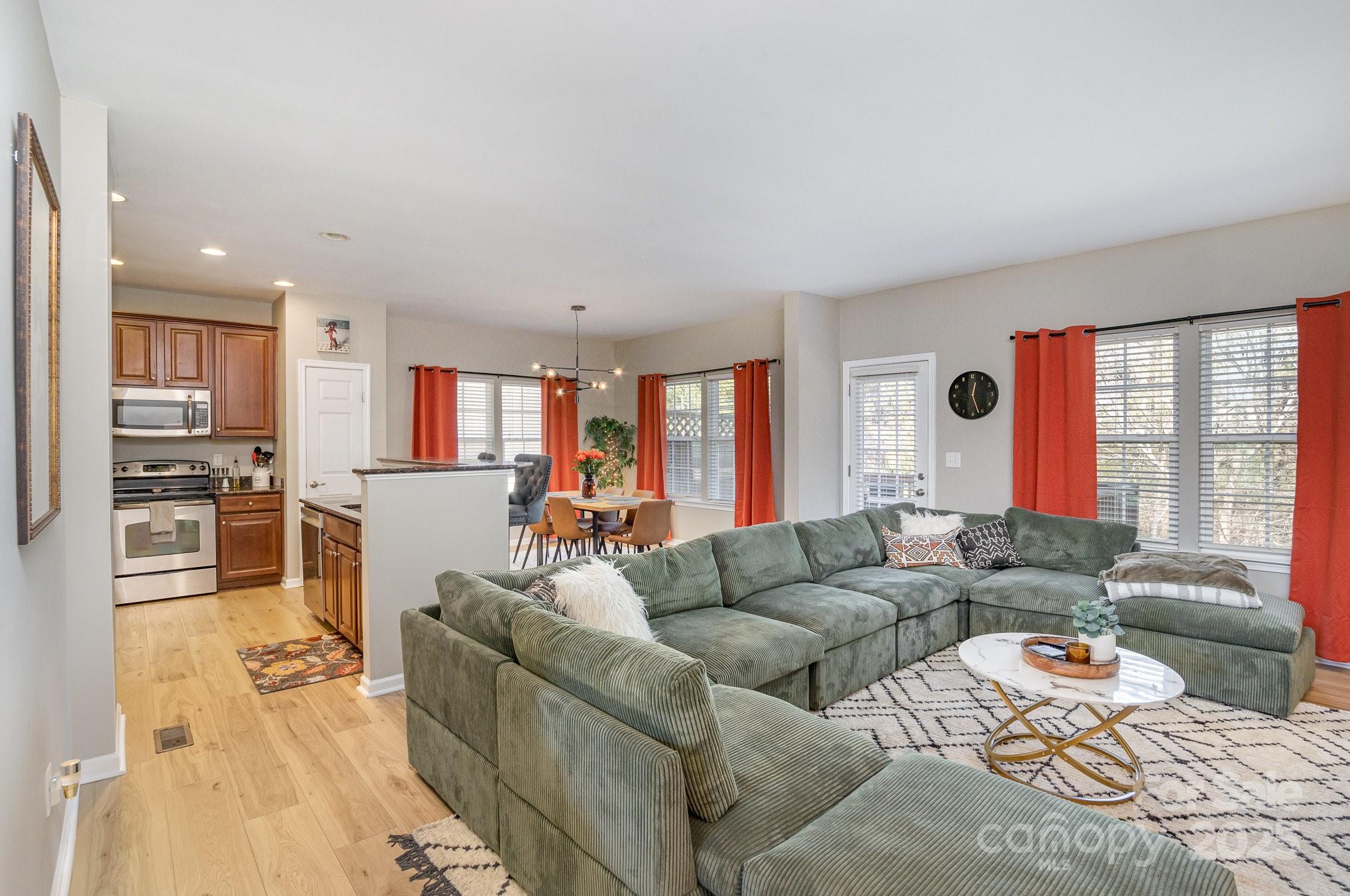 121 Inlet Point Drive Tega Cay, SC 29708 - Photo 5 of 18 a living room with furniture and a large window