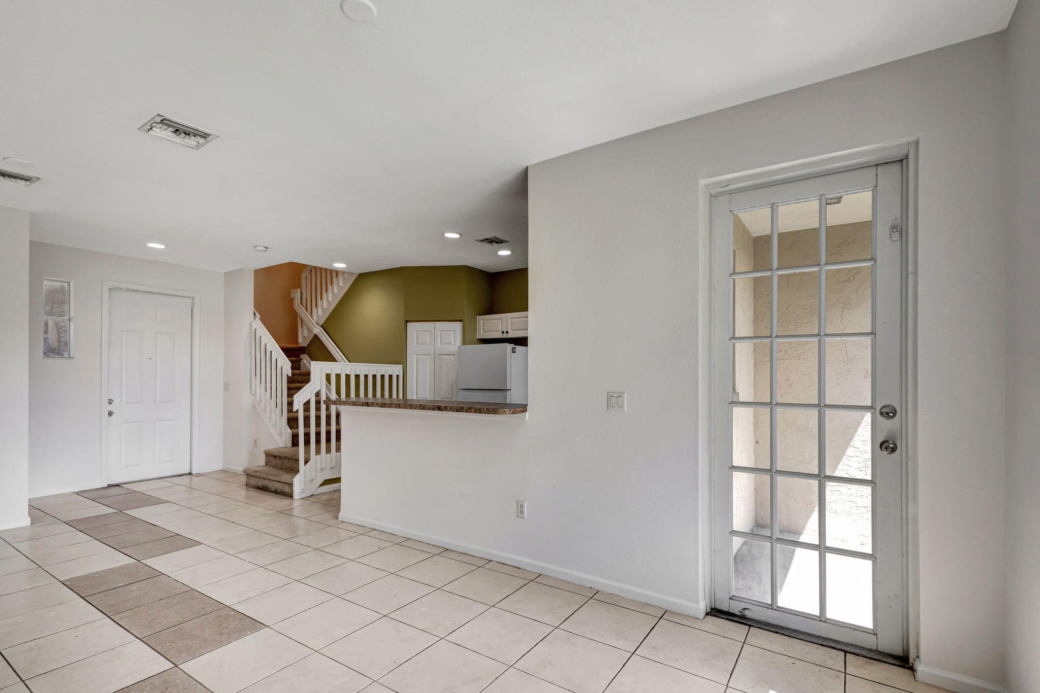 2025 Island Drive Riviera Beach, FL 33404 - Photo 13 of 46 a view of entryway and hall with a window