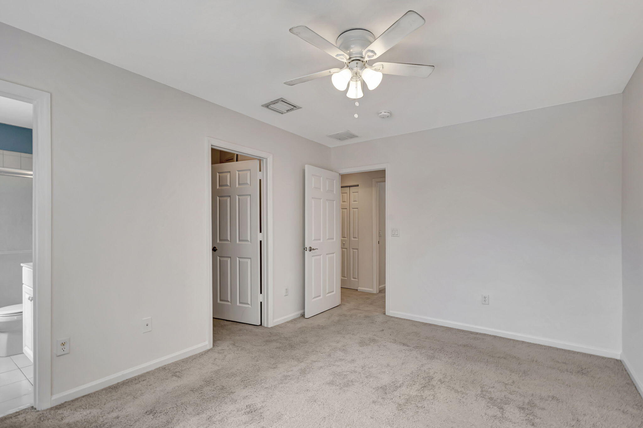 2025 Island Drive Riviera Beach, FL 33404 - Photo 20 of 46 an empty room with a ceiling fan and a window