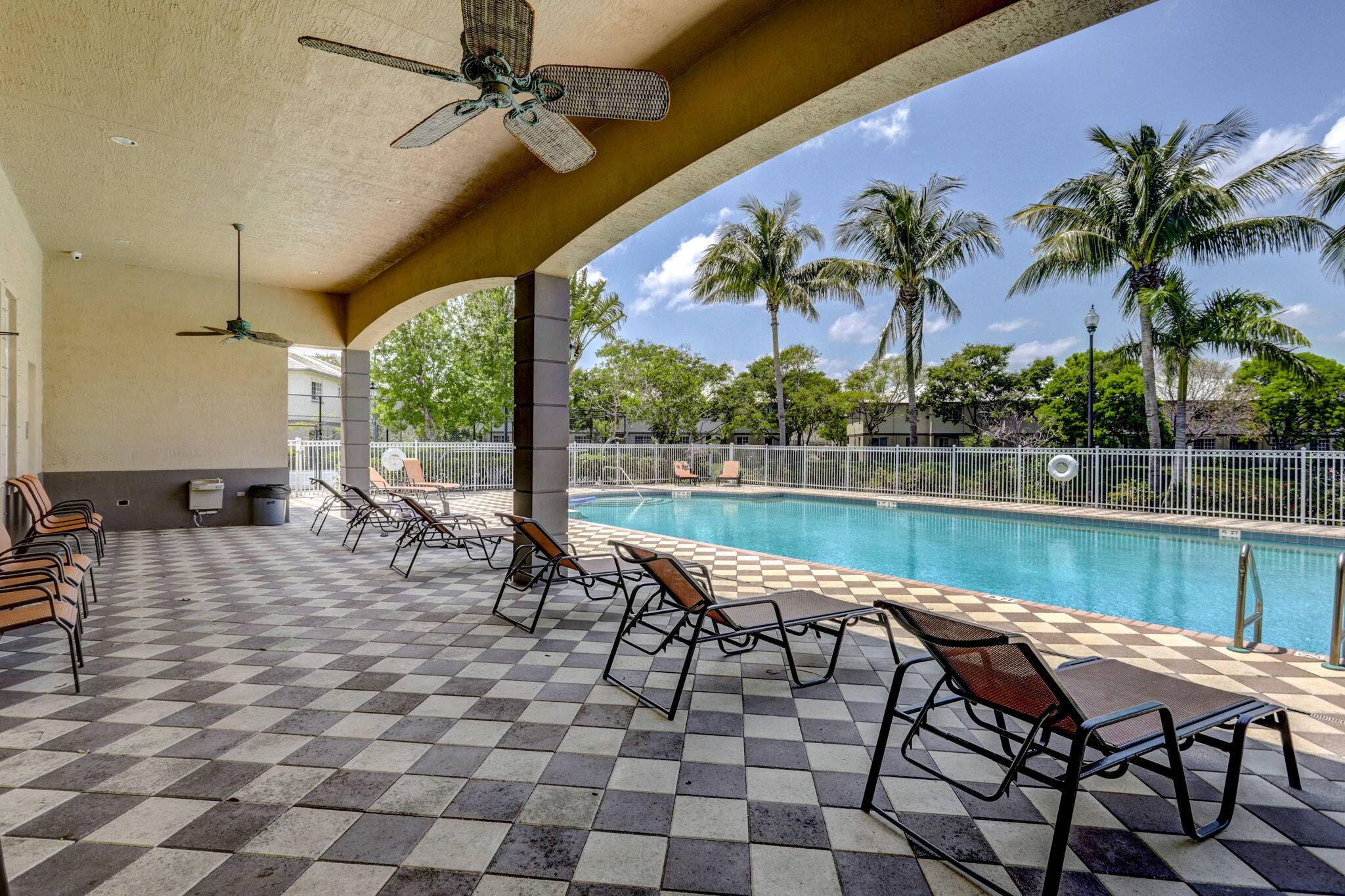 2025 Island Drive Riviera Beach, FL 33404 - Photo 42 of 46 a view of a lake with table and chairs