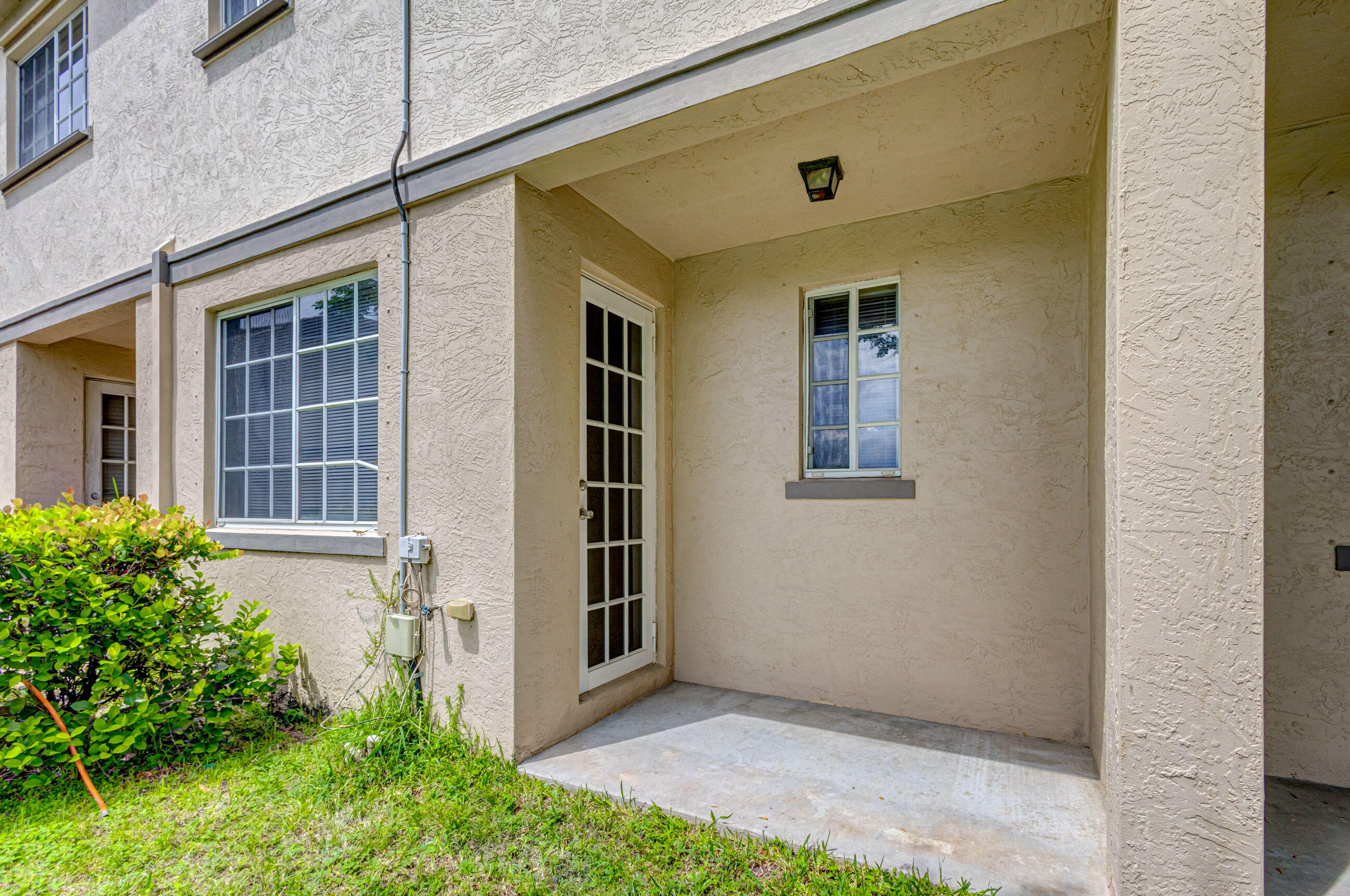 2025 Island Drive Riviera Beach, FL 33404 - Photo 9 of 46 front view of a house with a yard