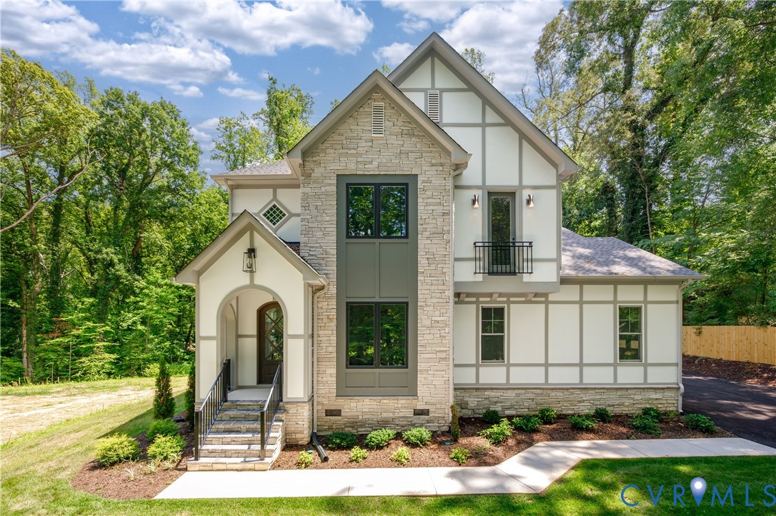8919 Rustic Road Richmond, VA 23235 - Photo 1 of 36 Stone and Tudor-style exterior featuring a covered