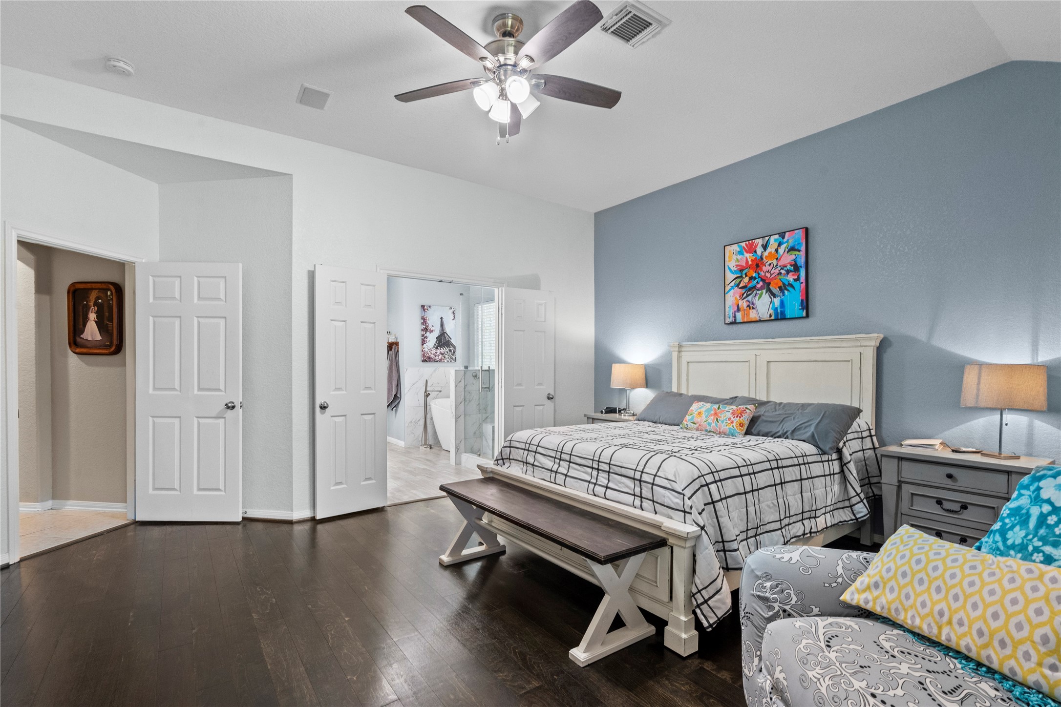 1011 Elm Pointe League City, TX 77573 - Photo 22 of 44 a bedroom with a bed and a chandelier