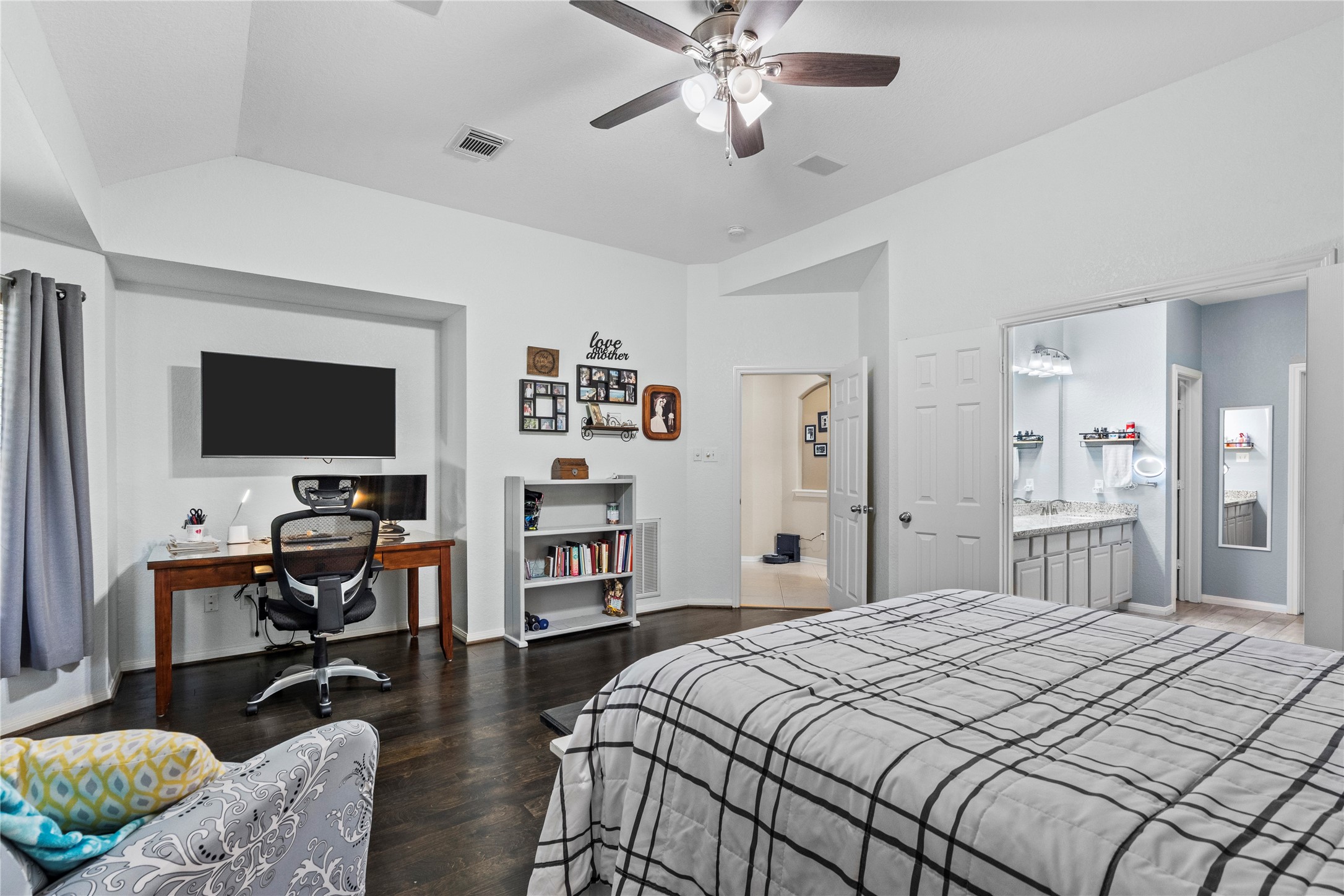 1011 Elm Pointe League City, TX 77573 - Photo 23 of 44 a bedroom with a bed and a flat screen tv