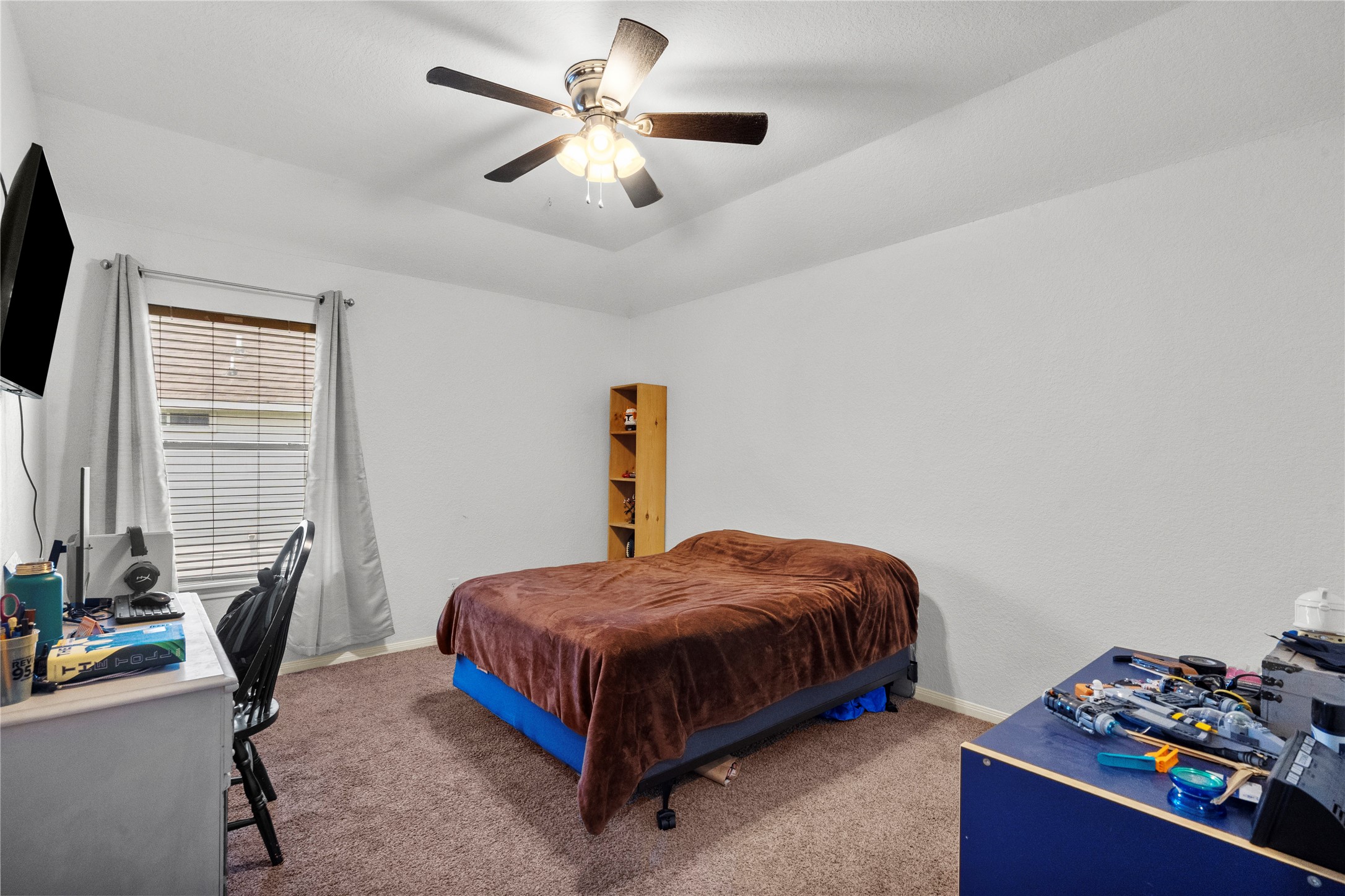 1011 Elm Pointe League City, TX 77573 - Photo 38 of 44 a bedroom with a bed and a chandelier