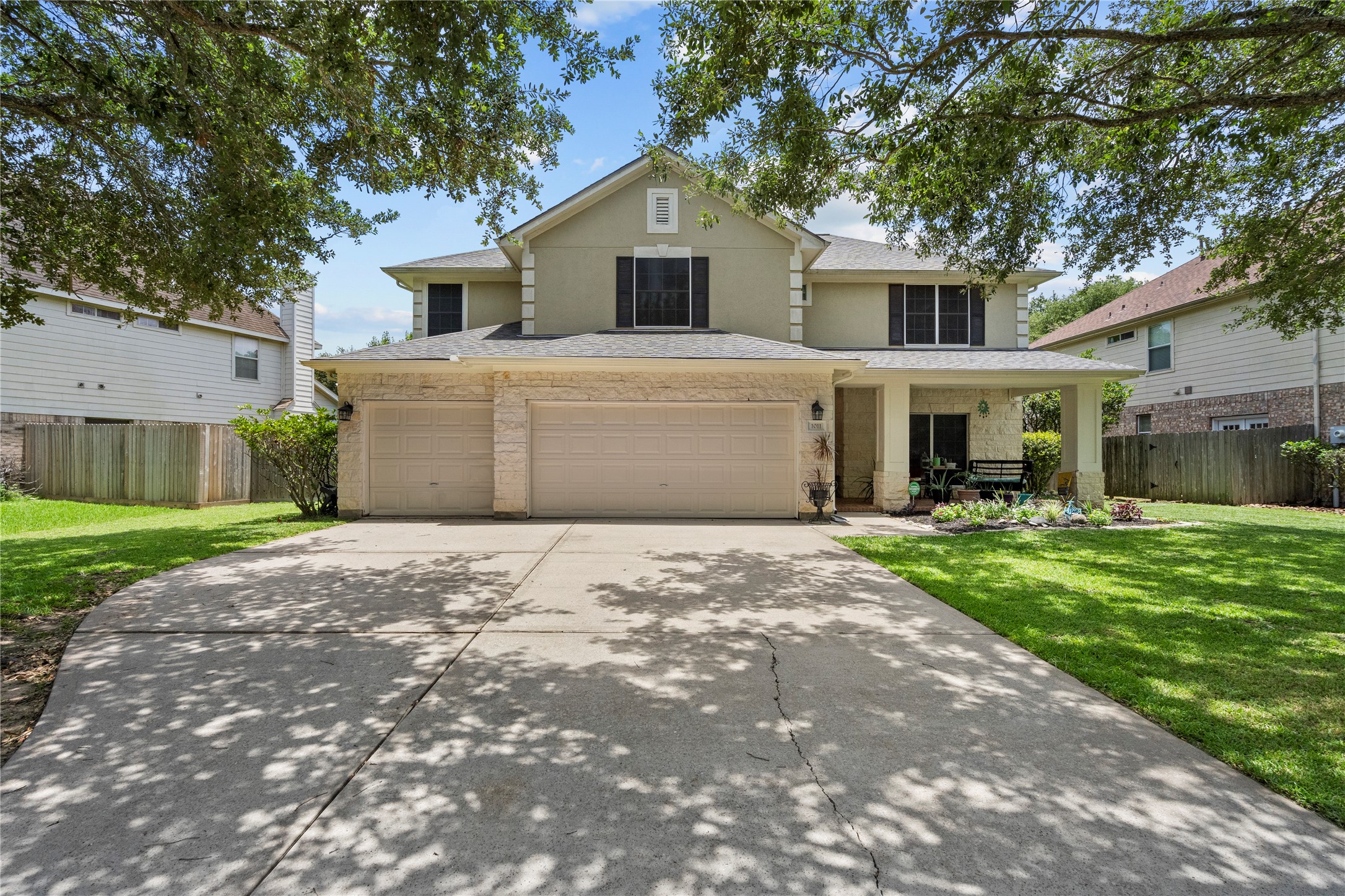 1011 Elm Pointe League City, TX 77573 - Photo 44 of 44 a front view of a house with a garden and yard