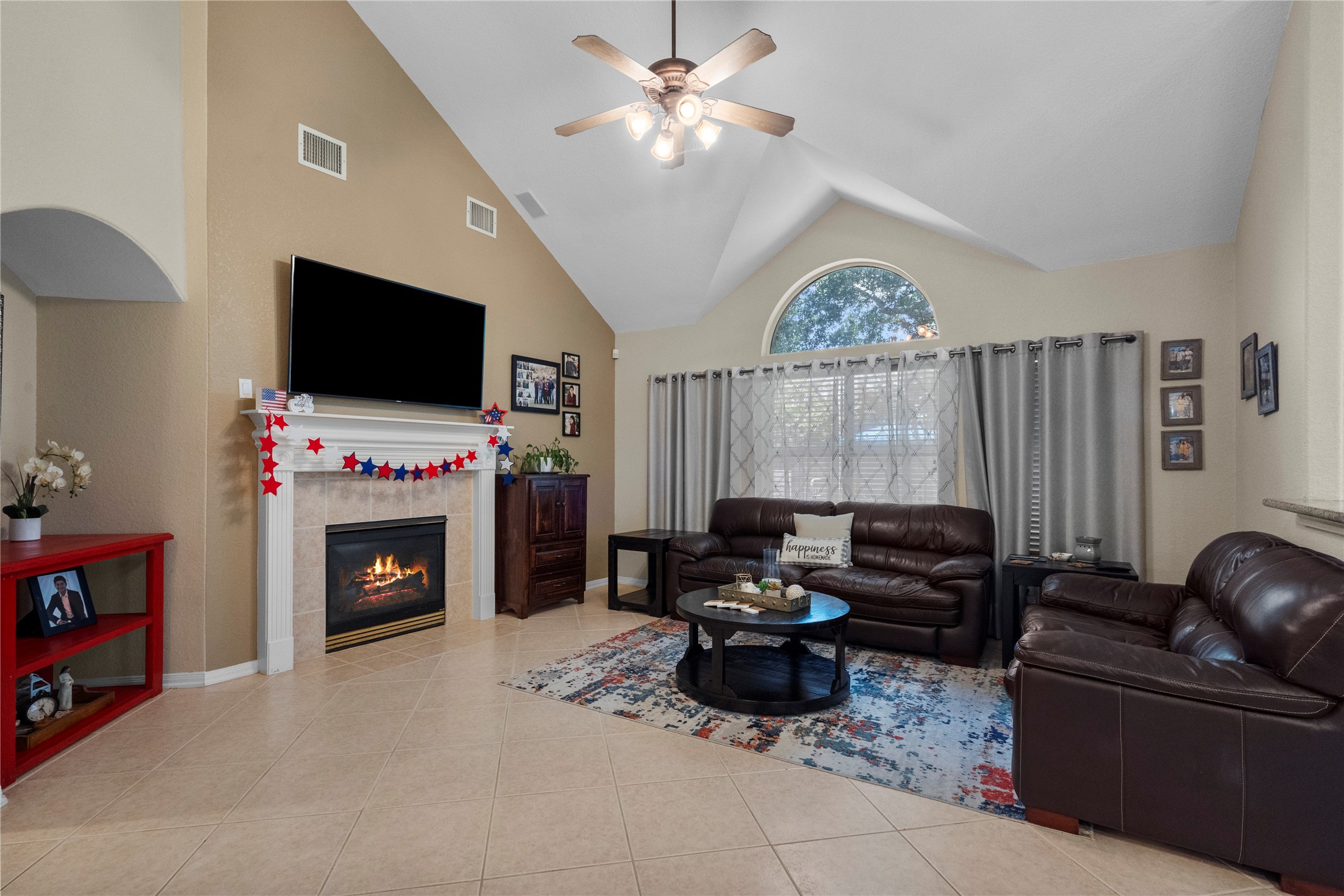 1011 Elm Pointe League City, TX 77573 - Photo 9 of 44 a living room with furniture a fireplace and a flat screen tv
