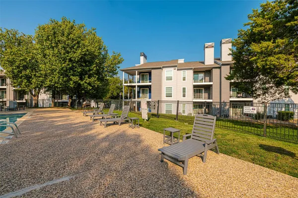 a view of a house with backyard porch and sitting area