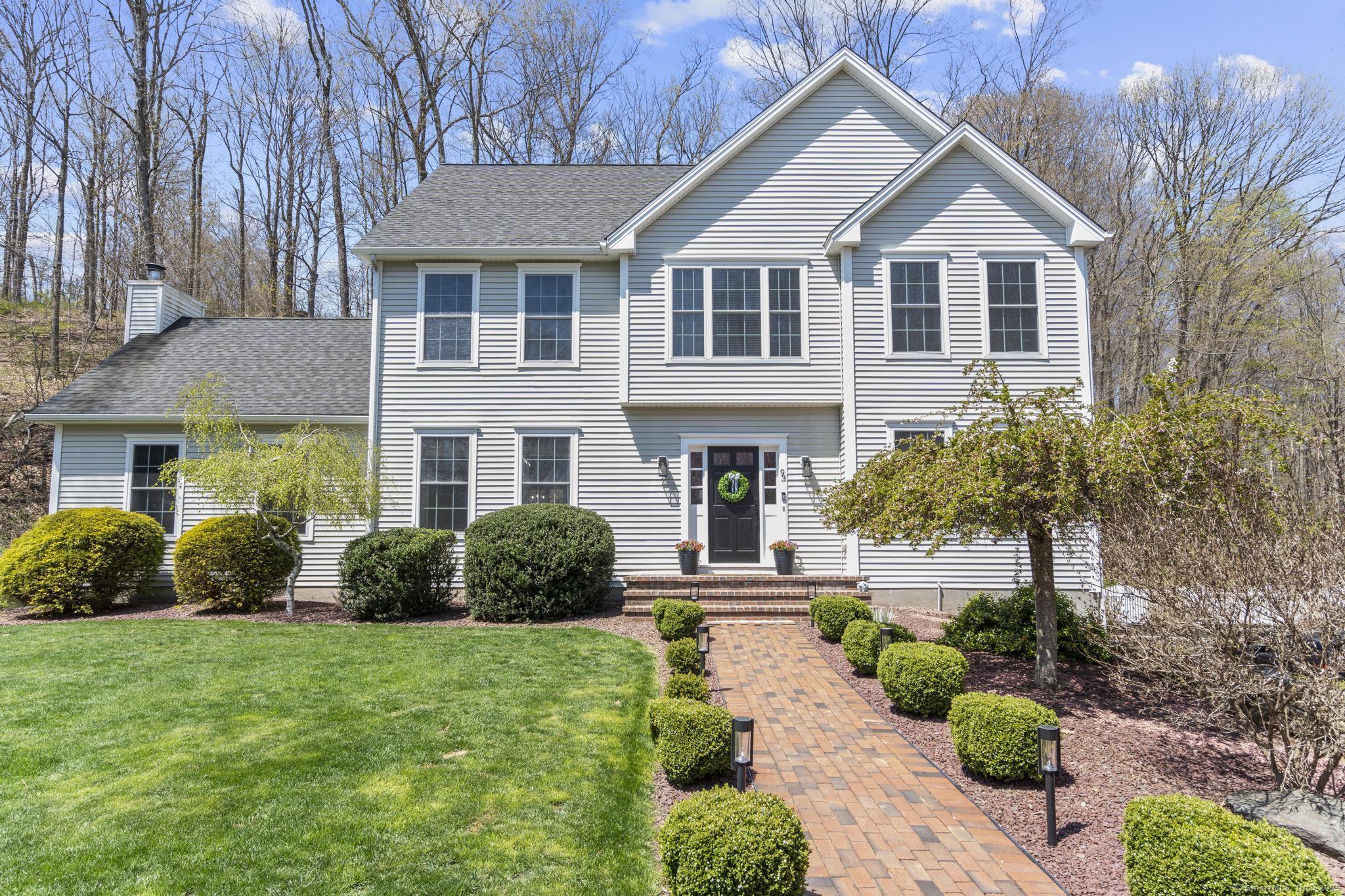 93 Bee Mountain Road Oxford, CT 06478 - Photo 1 of 1 a front view of a house with a yard and outdoor seating