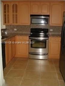 Silver Bluff Estates Miami, FL 33145 - Photo 10 of 13 a stove top oven sitting inside of a kitchen