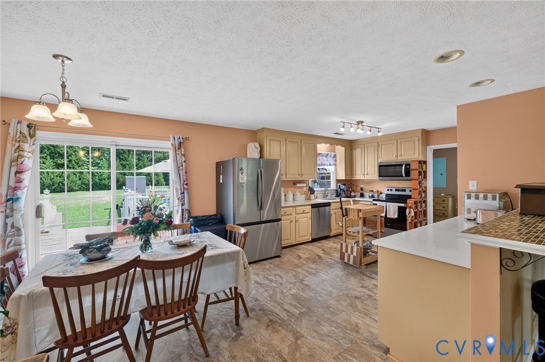 2335 Dorrell Road Aylett, VA 23009 - Photo 6 of 26 Kitchen with wood-finish flooring, light cabinetry