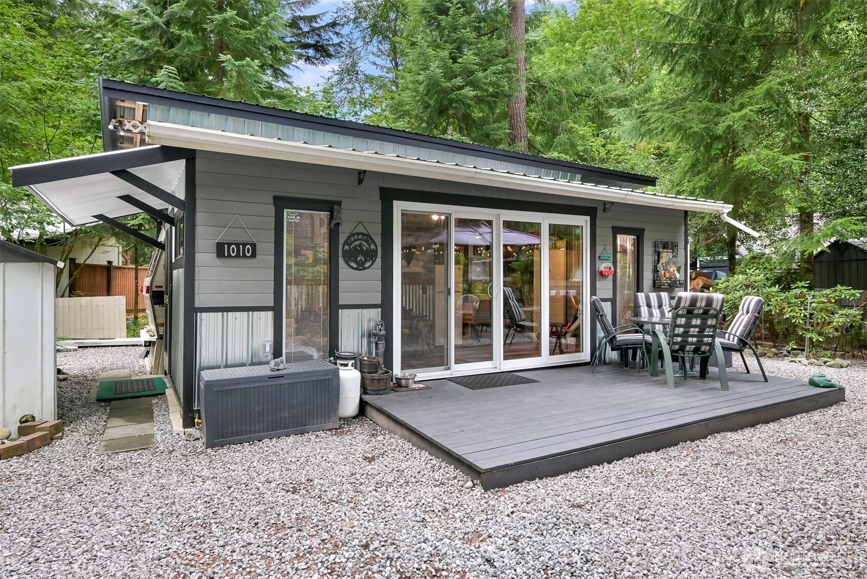1010 Maple Lane Maple Falls, WA 98266 - Photo 1 of 40 a view of a chair and table in backyard of the house
