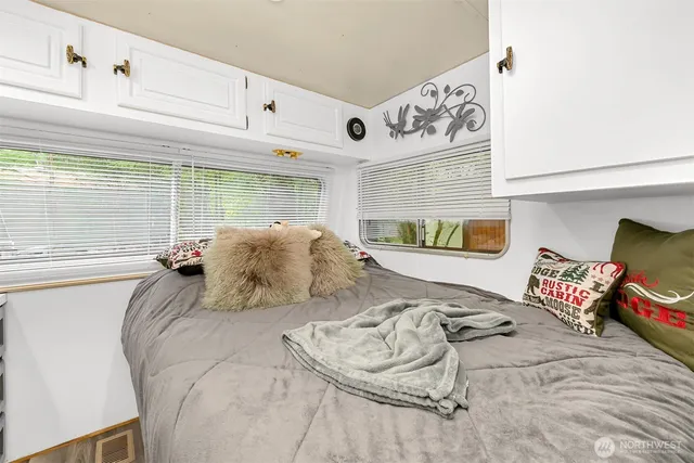 a bedroom with a bed and window