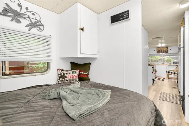 a bedroom with furniture and a window